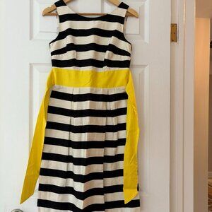 Chic Black & White Striped Dress with Bold Yellow Sash